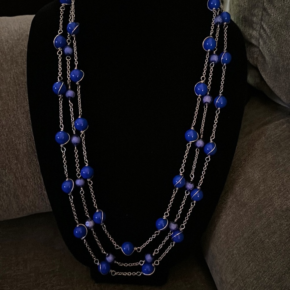 Vintage multi strand necklace with rich blue accents.